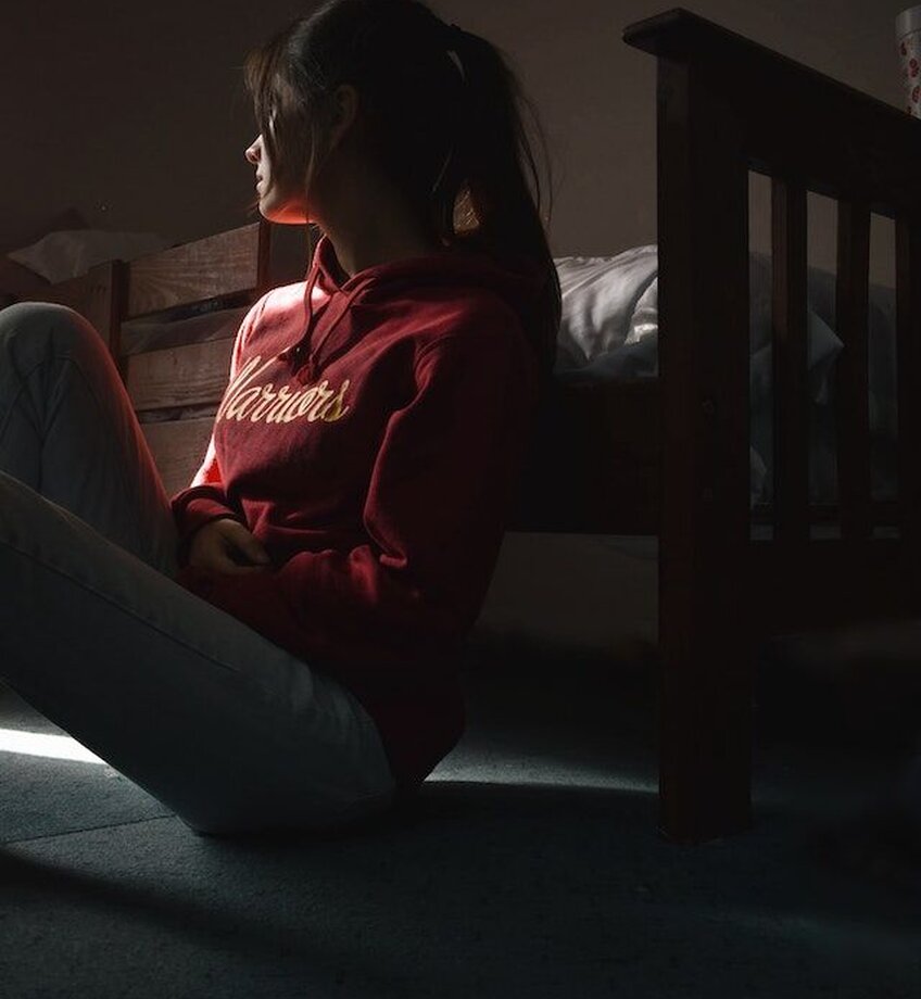 Photo Of Woman Sitting On Floor