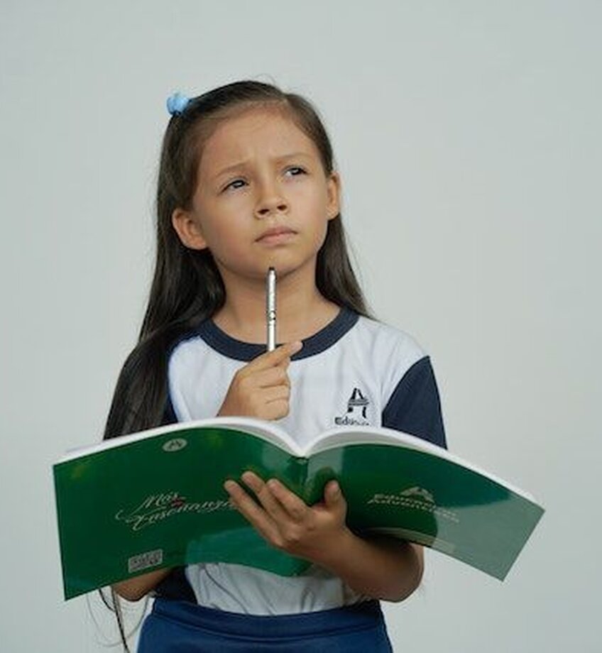 ensive Girl with School Notebook Thinking