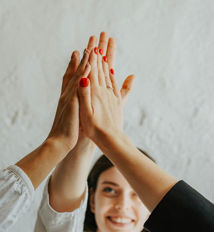 A Group of People Doing a High Five