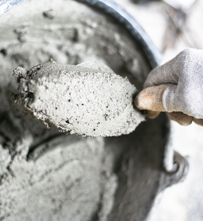 Cement or mortar, Cement powder with a trowel put on the brick at construction work.