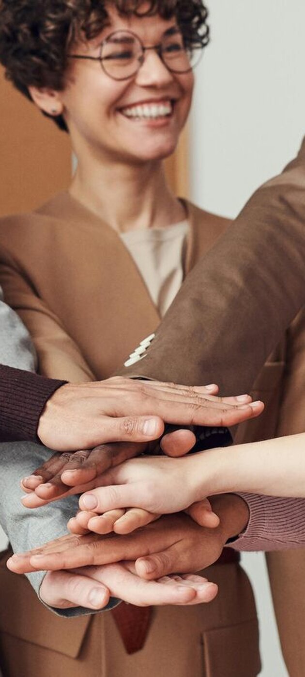 Persons holding hands together